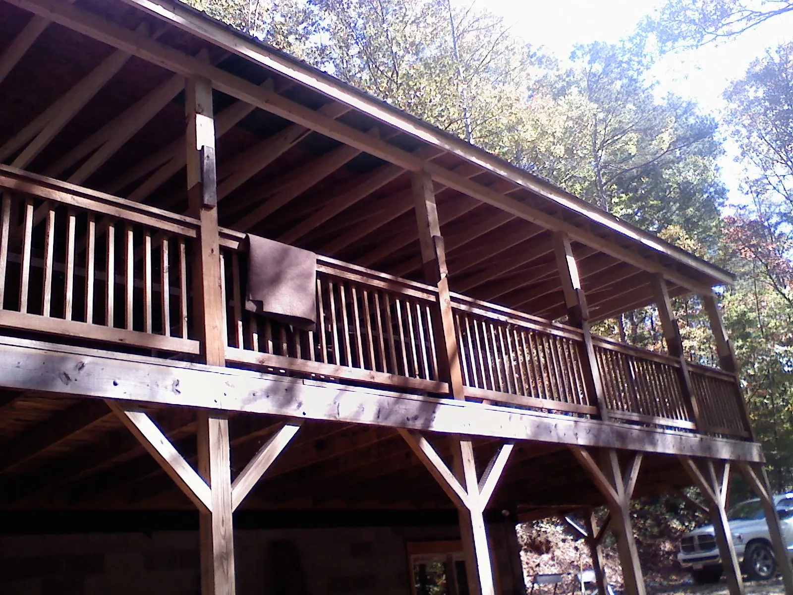 Timber framing under a new elevated porch and deck — Roof Leak Repair in Fowlerville by Roofing Brothers